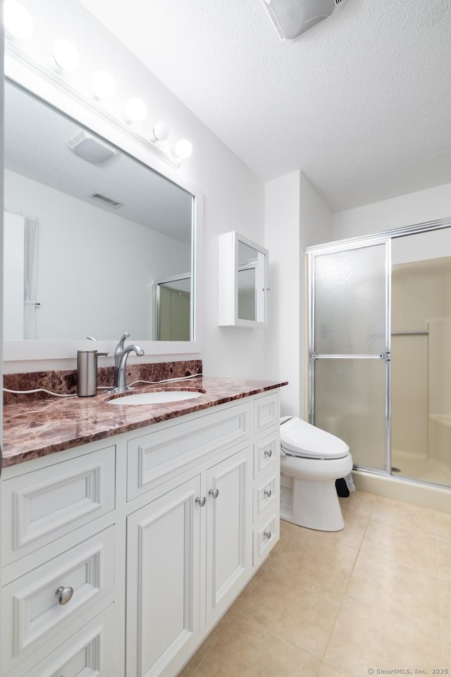 7 Copper Hill Dr Unit 7, Guilford, CT 06437 - bathroom with a stall shower, a textured ceiling, toilet, tile patterned floors, and vanity