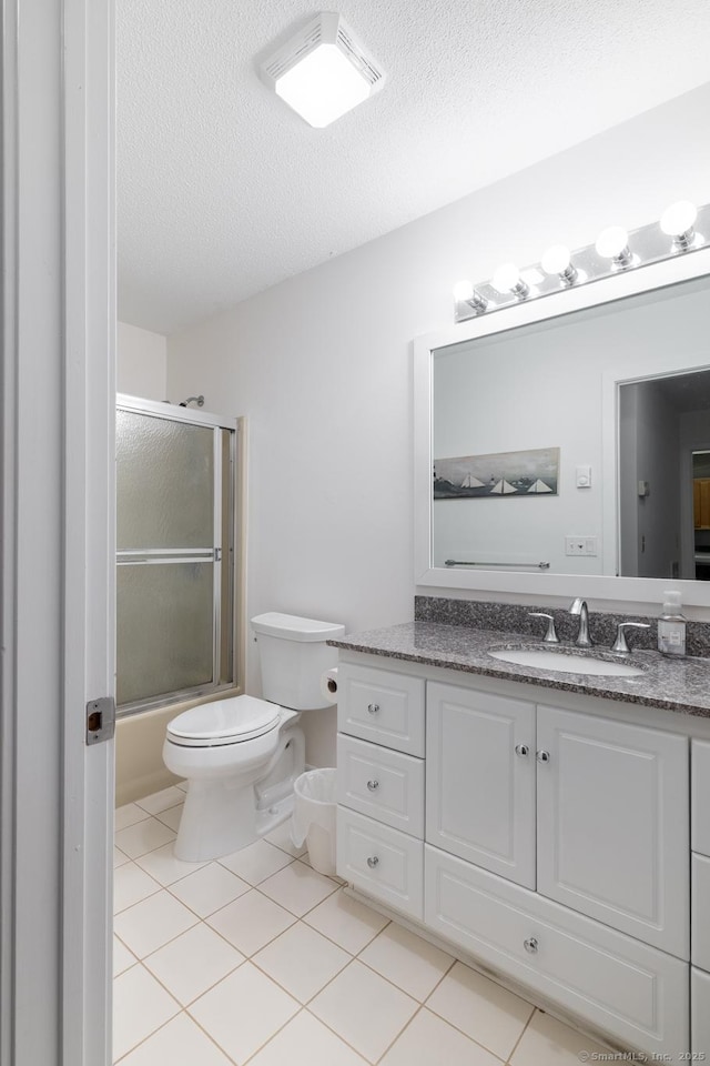 7 Copper Hill Dr Unit 7, Guilford, CT 06437 - full bathroom featuring vanity, toilet, a textured ceiling, and tile patterned flooring