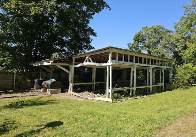 1067 Hartford Tpke, Waterford, CT 06385 - exterior space with a lawn and fence