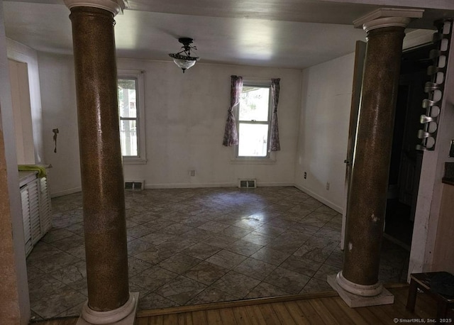 1067 Hartford Tpke, Waterford, CT 06385 - unfurnished room with baseboards, ornate columns, and visible vents