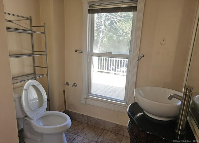 1067 Hartford Tpke, Waterford, CT 06385 - bathroom featuring vanity, baseboards, and toilet