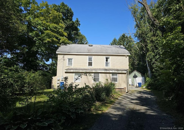 1067 Hartford Tpke, Waterford, CT 06385 - exterior space featuring a storage shed, an outdoor structure, and aphalt driveway
