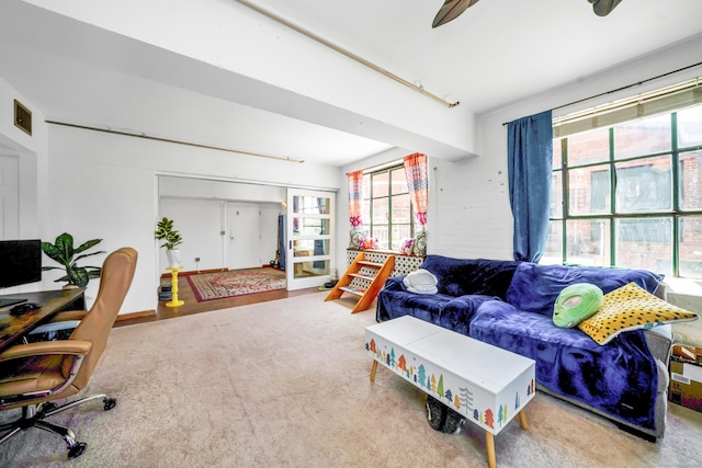 carpeted living area featuring visible vents