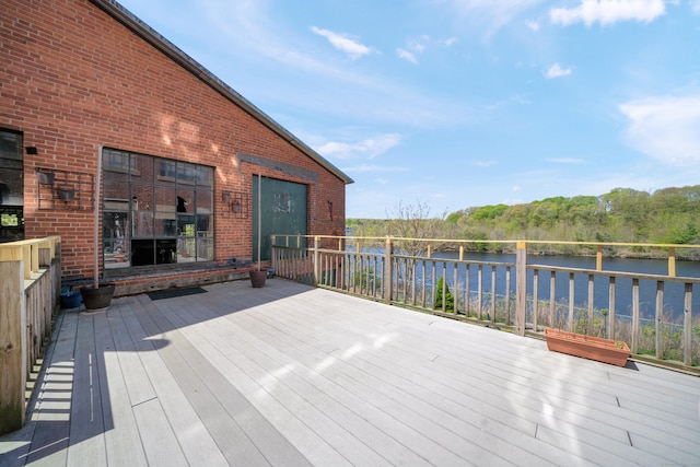 wooden terrace with a water view