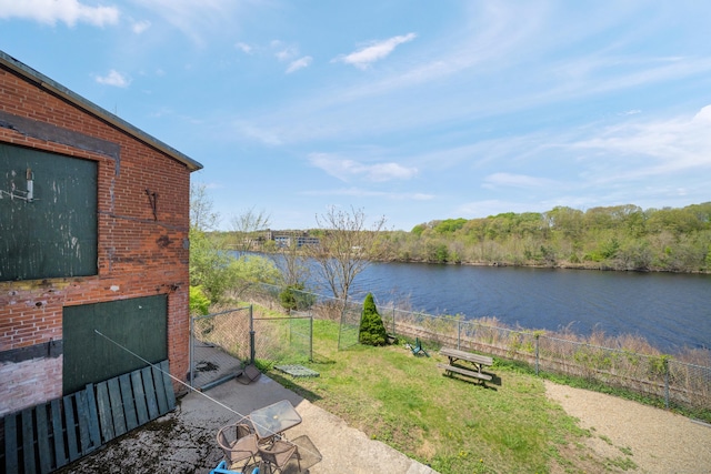 property view of water with fence and a gate