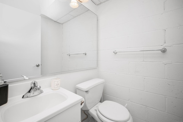 half bath with toilet and a sink