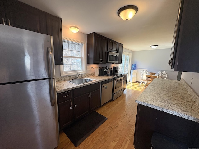 161 Old New London Rd, Salem, CT 06420 - kitchen with light wood-style floors, a sink, a wealth of natural light, and stainless steel appliances
