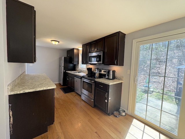 161 Old New London Rd, Salem, CT 06420 - kitchen featuring light countertops, appliances with stainless steel finishes, plenty of natural light, and light wood finished floors