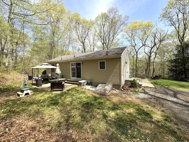 161 Old New London Rd, Salem, CT 06420 - back of property with a lawn, a patio area, and an outdoor hangout area
