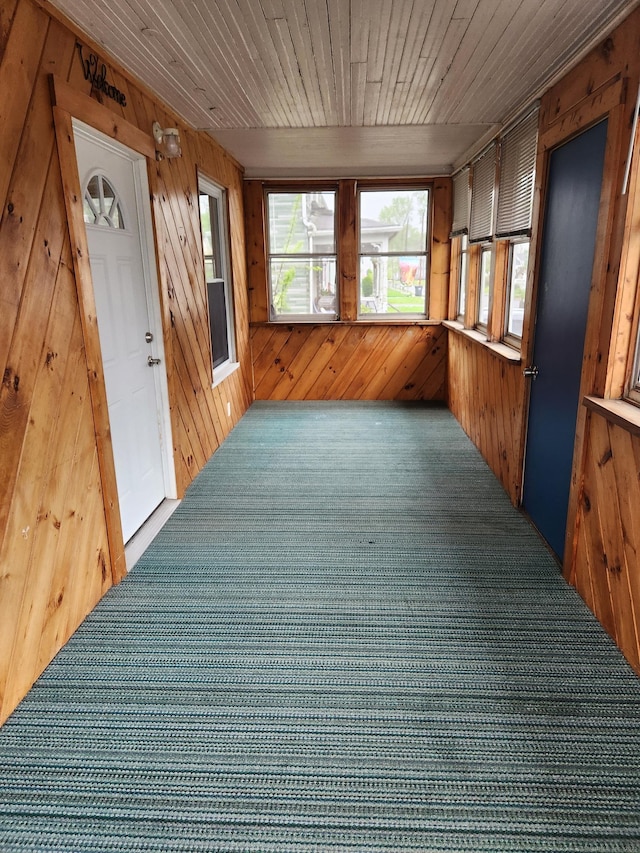 unfurnished sunroom with a wealth of natural light