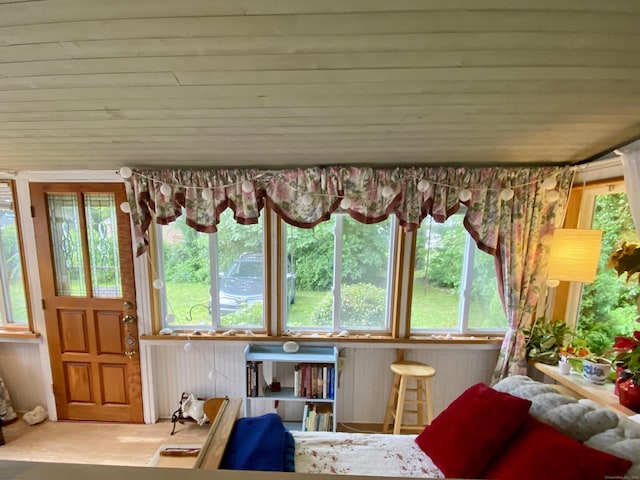 interior space with multiple windows and wooden ceiling