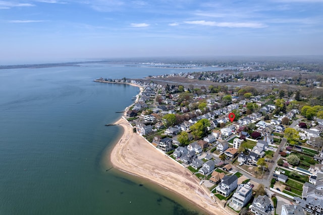 birds eye view of property featuring a water view and a residential view