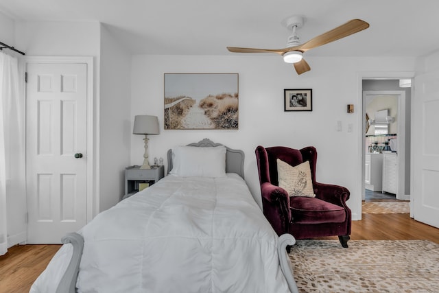 bedroom featuring ceiling fan and wood finished floors