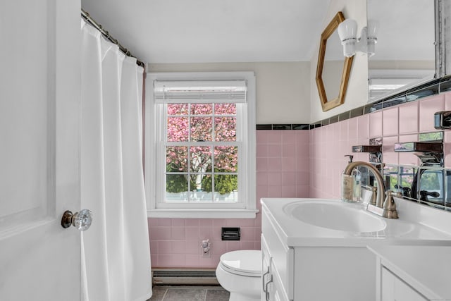 full bathroom with toilet, tile walls, tile patterned flooring, vanity, and a baseboard radiator