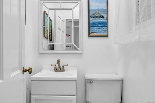 half bath with vanity and toilet