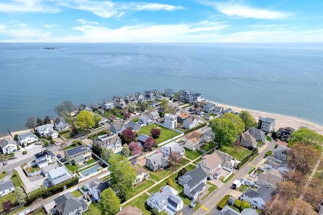 drone / aerial view with a water view and a residential view