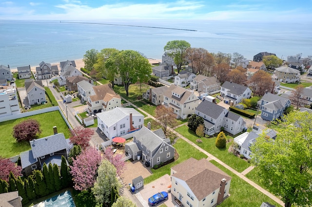 bird's eye view featuring a water view and a residential view