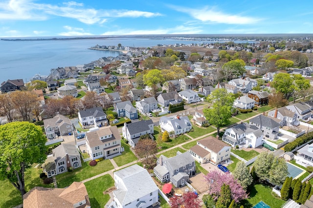 bird's eye view with a water view and a residential view