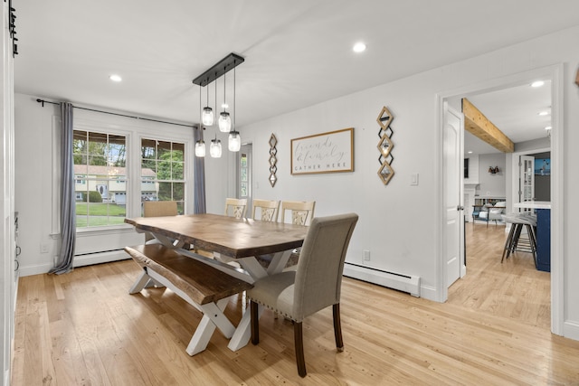 dining area featuring a baseboard heating unit, light wood-style floors, recessed lighting, and baseboards