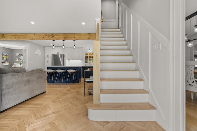 staircase featuring recessed lighting