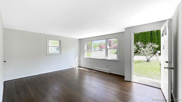76 Midway Dr, Bethel, CT 06801 - interior space with a baseboard heating unit, baseboards, and dark wood-type flooring