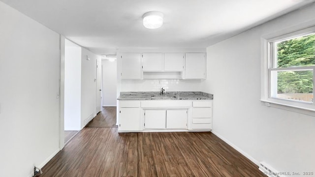 76 Midway Dr, Bethel, CT 06801 - kitchen with white cabinetry, backsplash, a sink, and dark wood-type flooring
