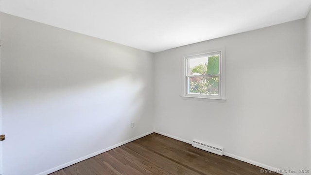76 Midway Dr, Bethel, CT 06801 - empty room featuring baseboards, dark wood-style flooring, a baseboard radiator, and visible vents