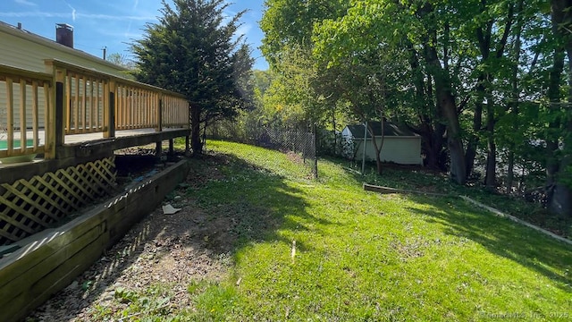 76 Midway Dr, Bethel, CT 06801 - view of yard with a deck, an outbuilding, and a shed