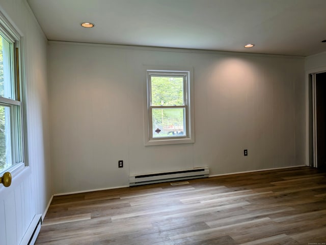 74 Midway Dr, Bethel, CT 06801 - spare room featuring a baseboard radiator, wood finished floors, and recessed lighting