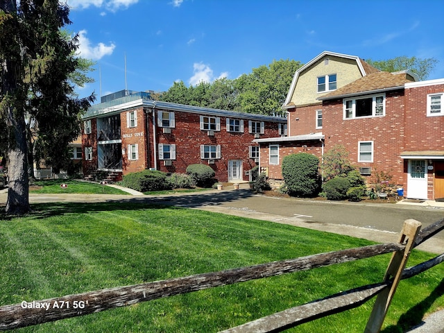 24 Home Ct Unit 7, Stamford, CT 06902 - view of front of house with a front lawn and brick siding