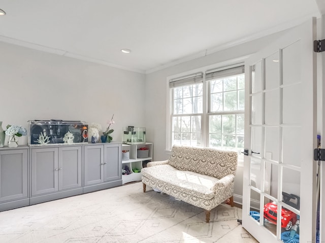 living area with recessed lighting and ornamental molding