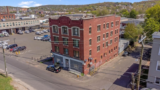 view of property with uncovered parking