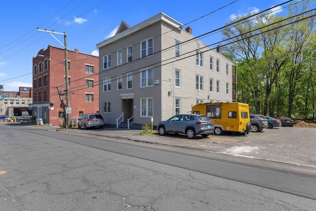view of property featuring uncovered parking