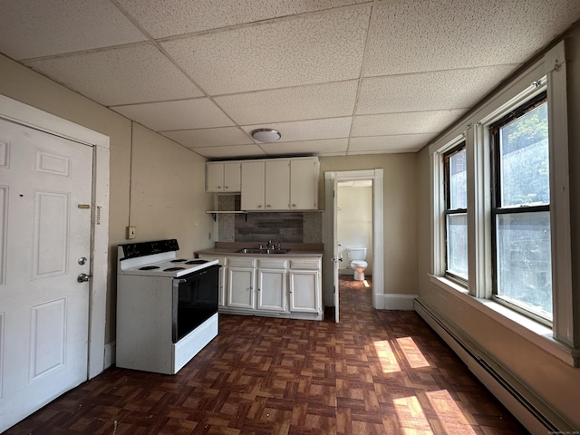 kitchen featuring a sink, a baseboard radiator, white electric range oven, and a drop ceiling