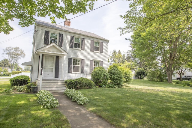 62 Lynde St, Old Saybrook, CT 06475 - colonial home featuring a chimney and a front yard