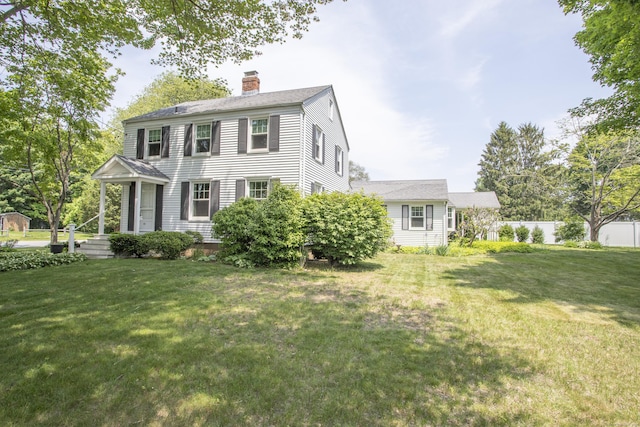 62 Lynde St, Old Saybrook, CT 06475 - colonial-style house featuring a chimney