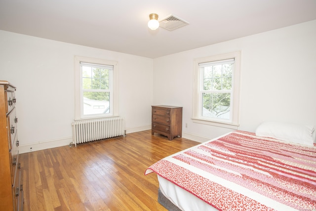 62 Lynde St, Old Saybrook, CT 06475 - bedroom featuring radiator, wood finished floors, and baseboards