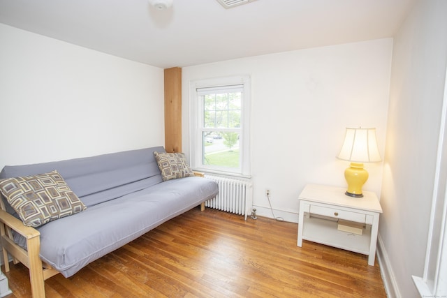62 Lynde St, Old Saybrook, CT 06475 - sitting room with radiator heating unit, wood finished floors, and baseboards