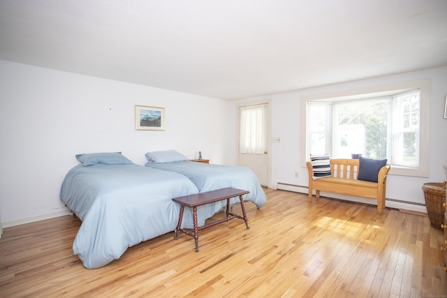 62 Lynde St, Old Saybrook, CT 06475 - bedroom featuring light wood finished floors and a baseboard heating unit
