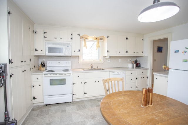 62 Lynde St, Old Saybrook, CT 06475 - kitchen with white appliances, a sink, white cabinetry, and light countertops