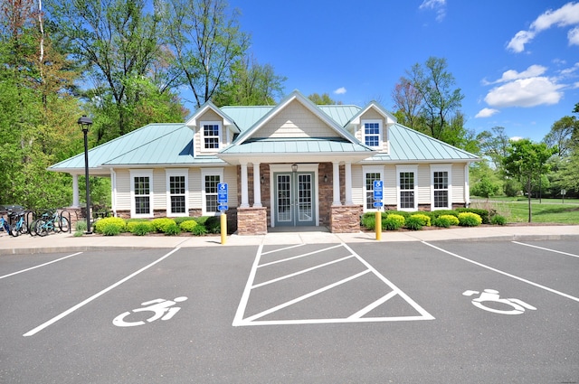 view of building exterior featuring uncovered parking