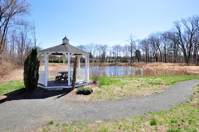 view of home's community with a gazebo and a water view