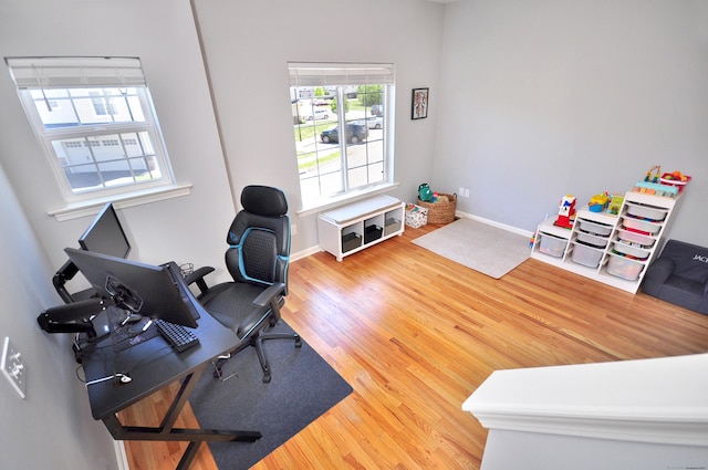 home office with wood finished floors and baseboards