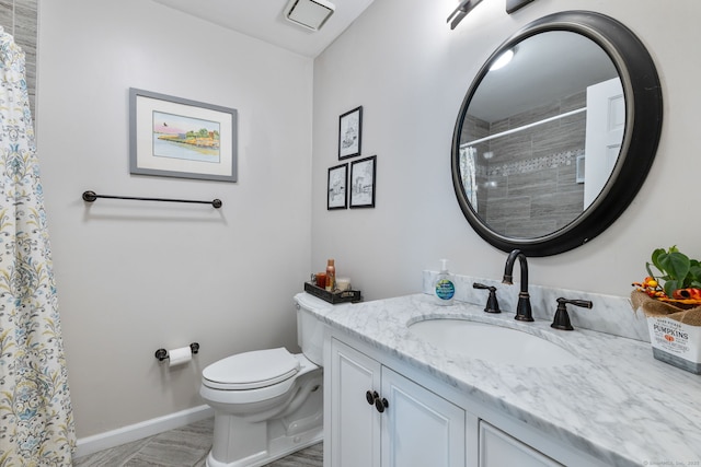 bathroom featuring toilet, baseboards, visible vents, curtained shower, and vanity