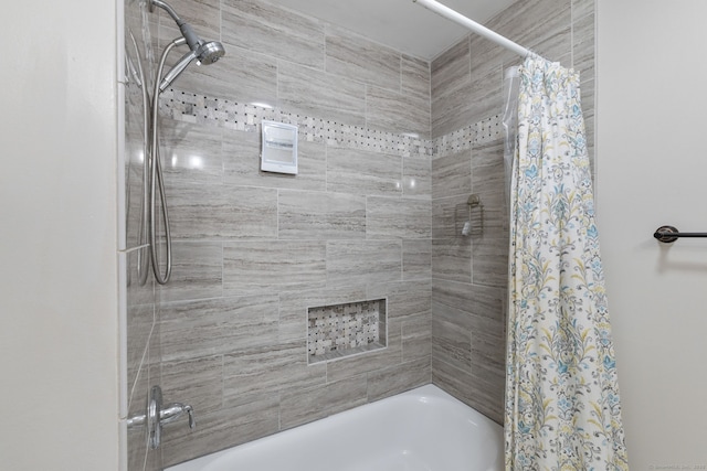 full bathroom featuring shower / bath combo with shower curtain