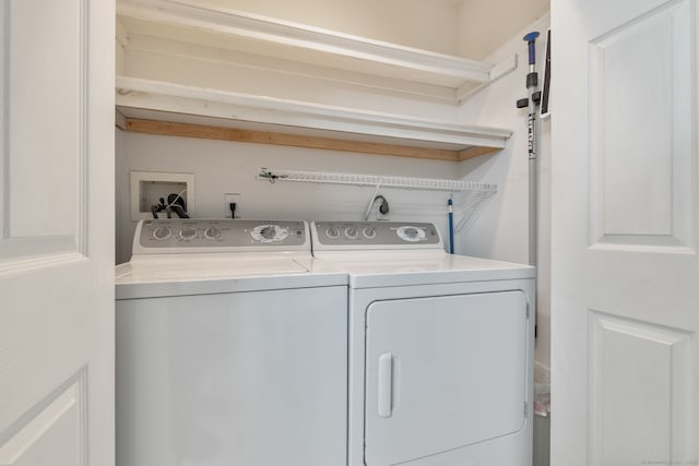 laundry room featuring washer and clothes dryer and laundry area