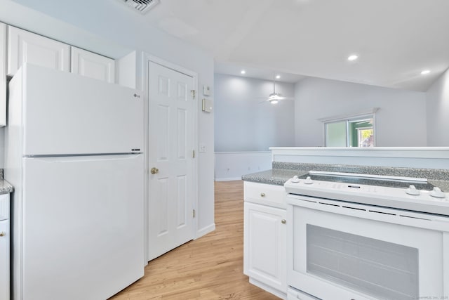 kitchen featuring white cabinets, visible vents, white appliances, light wood-style floors, and recessed lighting