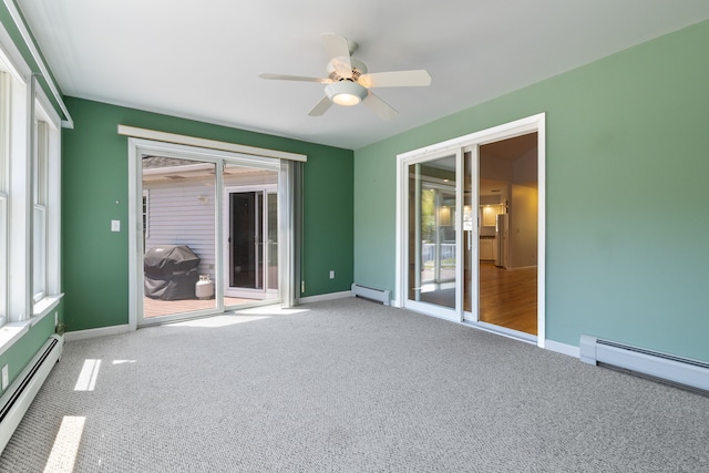 unfurnished sunroom featuring baseboard heating