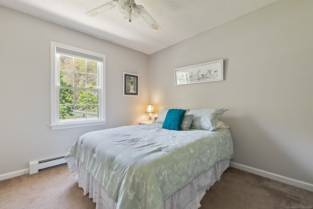 carpeted bedroom with a baseboard radiator, a textured ceiling, baseboards, and a ceiling fan