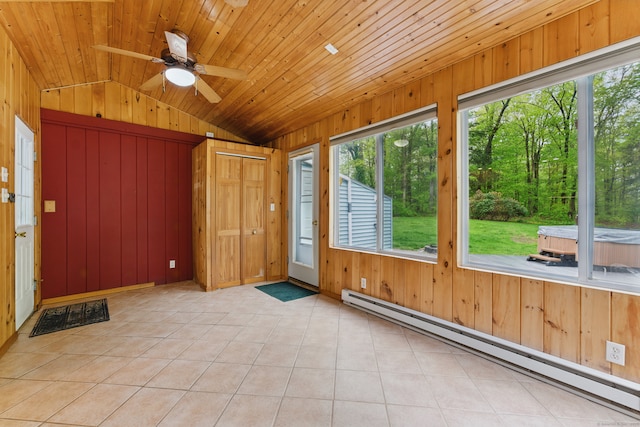 unfurnished sunroom featuring a baseboard radiator, vaulted ceiling, healthy amount of natural light, and a jacuzzi